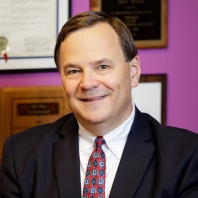 Paul Furiga speaking on stage at the Software Oasis™ B2B Executive AI Bootcamp about his take on story-first B2B growth statistics.